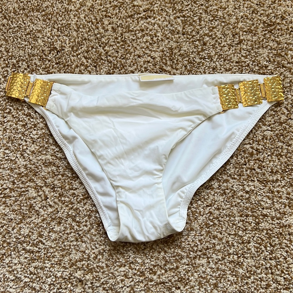 New. No tag. Never worn.Swim bottoms. Gold metal sides